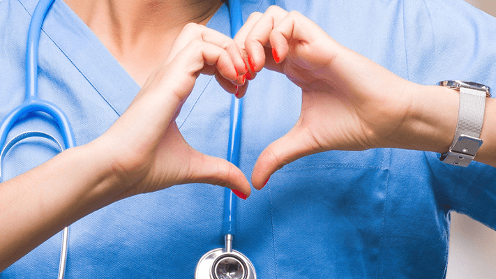 uofl-health-companyupdate-1663333066681 A nurse symboling a heart with her hands, representing the importance of Trauma Center philanthropy